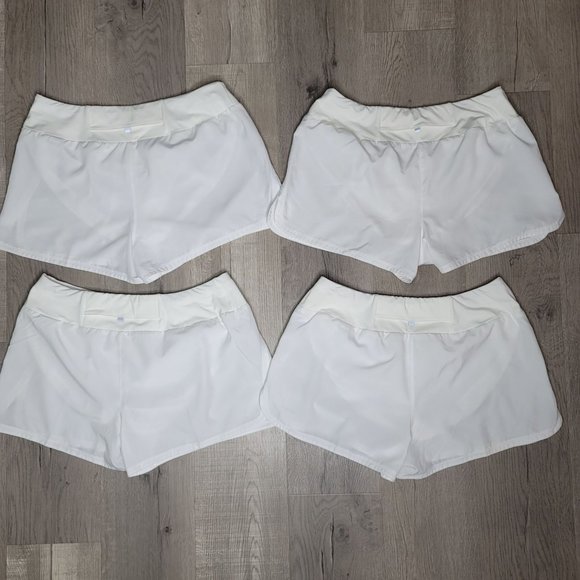 Nike dri fit white running shorts set of 4. pocket on back with lining size Larg - Picture 6 of 13